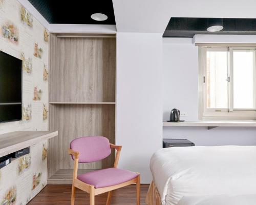 Postel nebo postele na pokoji v ubytování Bon Hotel Taipei