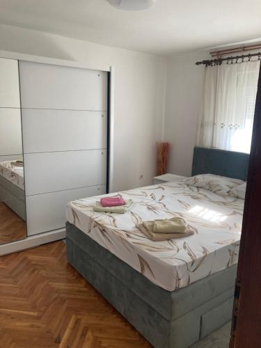 a bedroom with a bed with two pillows on it at Nevade home in Gornji Milanovac