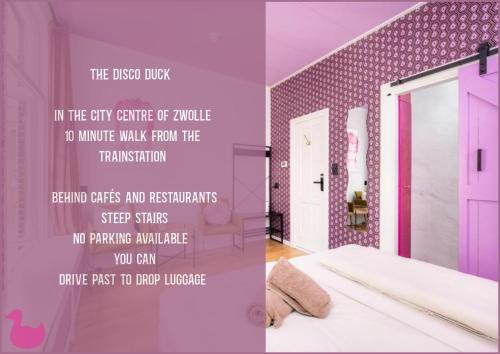 a room with a pink door and a room with a bed at The Disco Duck B - city centre Zwolle in Zwolle