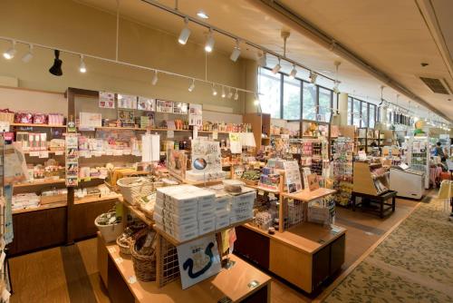 a store with a lot of products on display at Kusatsu Onsen Hotel Village in Kusatsu