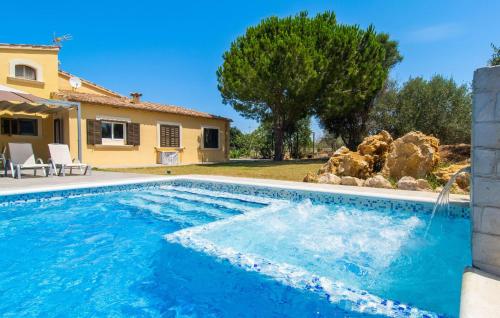 a pool in front of a house at Can Paxaco in Alcudia