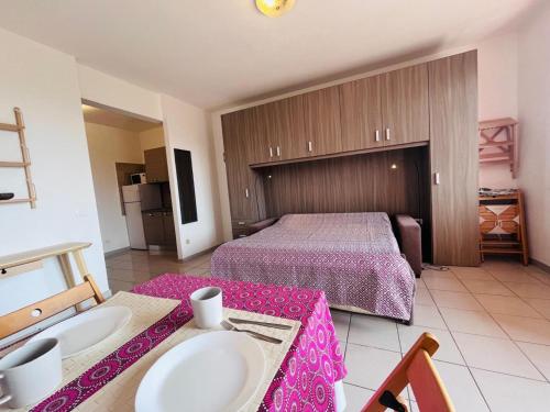 a hotel room with two sinks and a bed at Capoliveri Lecce Home in Capoliveri