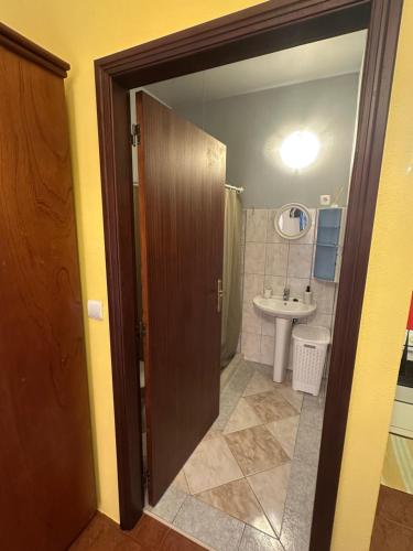 a bathroom with a toilet and a sink at Casa Mary Bela's in Ponta do Sol