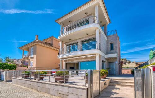 a large house with a fence in front of it at Bohemi in Son Serra de Marina