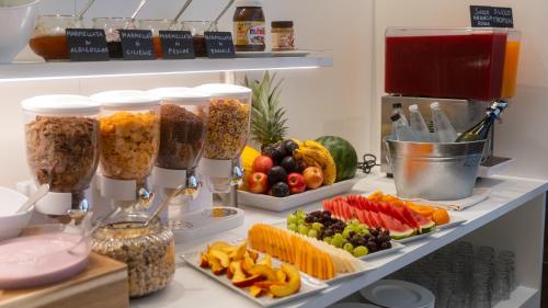 a shelf with many different types of food at Hotel Jesolo Sand in Lido di Jesolo