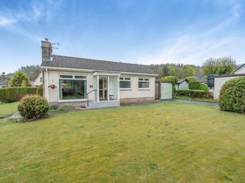 a house with a large yard in front of it at The Mulberry in Lamlash