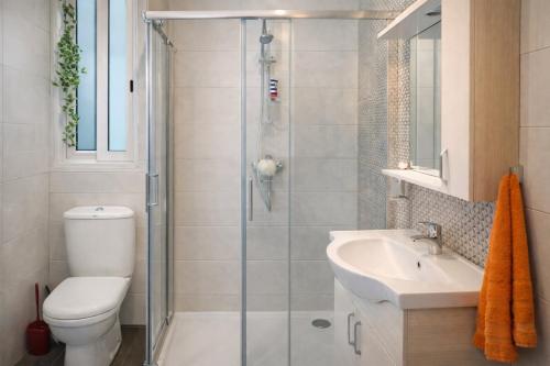 a bathroom with a shower and a toilet and a sink at Comfortable ! Stylish ! Fully Air Conditioned ! in Sannat