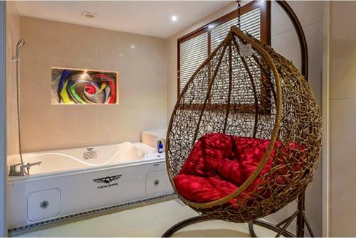 a bathroom with a swing in front of a tub at Hotel Campanella in Seoul