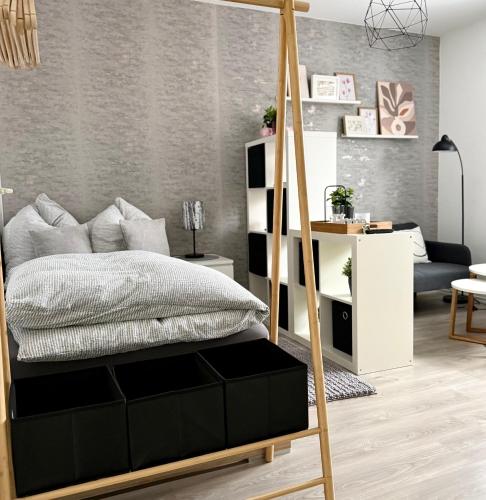 a bedroom with a bed and a desk at Solo by Zirwick Apartment in Weiherhammer
