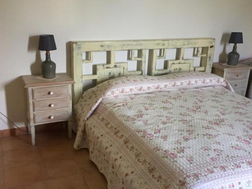 a bedroom with a bed and two night stands at Locanda Marzi in Faicchio