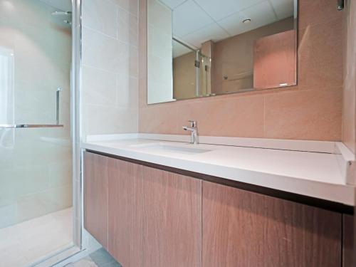 a bathroom with a sink and a mirror at Elegant 1-Bedroom Apartment in Al Furjan-710 in Dubai