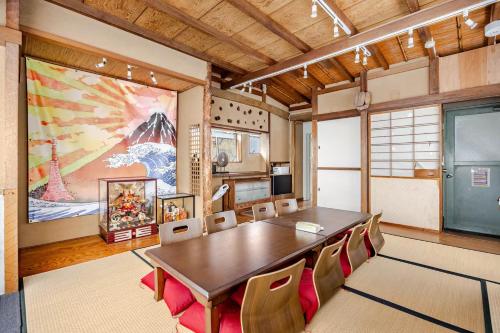 a conference room with a large table and chairs at Large Private House for 18 Tokyo Tower JR Hamamatsucho 8min HOTEL Musashi Tokyo Shiba in Tokyo