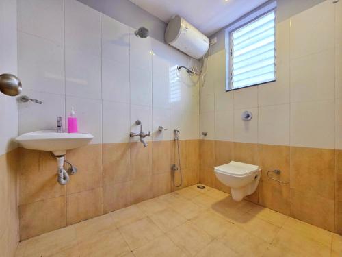 a bathroom with a sink and a toilet at ll EMPYREAN STAYS ll SUPREME VILLA II 3BHK II AC II PVT POOL II MINI BAR in Lonavala