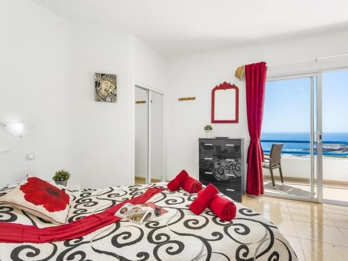 a bedroom with a large bed with a view of the ocean at 1316 Paraiso Sur, Amazing view in Playa Paraiso
