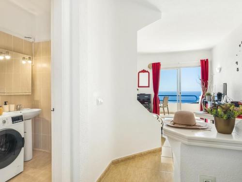 a kitchen with a sink and a washing machine at 1316 Paraiso Sur, Amazing view in Playa Paraiso