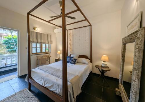 Llit o llits en una habitació de Villa Candolim