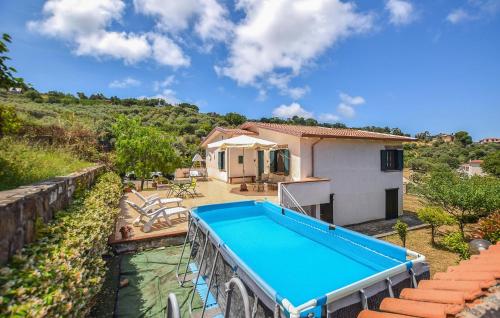 a villa with a swimming pool and a house at Amazing Home In Perdifumo in Perdifumo