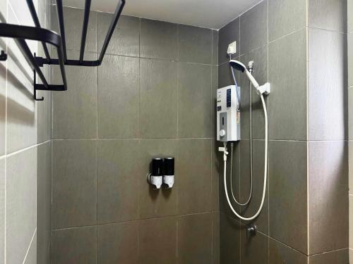 a shower in a bathroom with a shower at Almyra cozy condo in Kajang