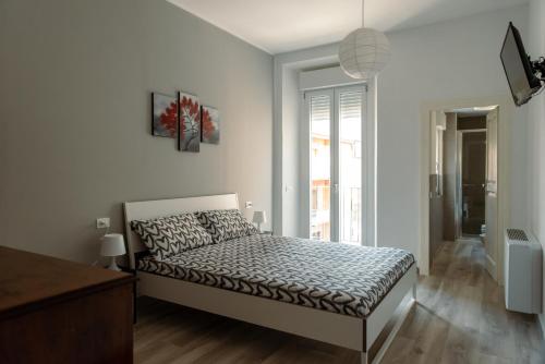 a bedroom with a bed in a white room at Tenuta Mastro in Sulmona