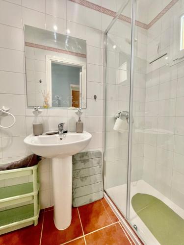a bathroom with a sink and a shower at Albatros Golf 2 - Islantilla in Isla Cristina