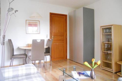 a living room with a table and a dining room at Rugstieg 8 Whg 2 in Wyk auf Föhr