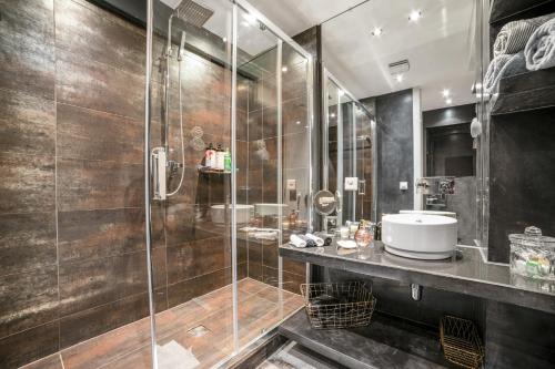 a bathroom with a shower and a sink at Fontaine in Geneva
