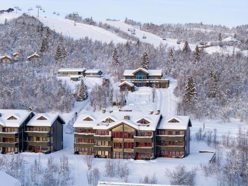 an aerial view of a resort in the snow at Nice And Central With Terrace in Beitostøl