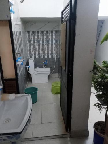 a bathroom with a toilet and a sink at OP krishna homestay in Mathura