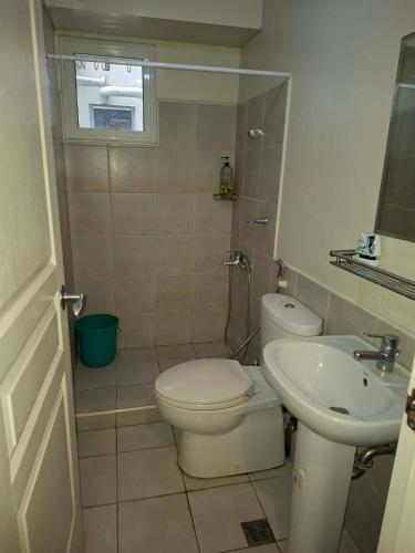 a bathroom with a toilet and a sink at Celadon Tower- Studio with balcony near SM San Lazaro in Manila