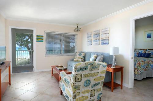 a living room with a couch and a chair at Pet-Friendly And Really Close To Beach! in Bradenton Beach