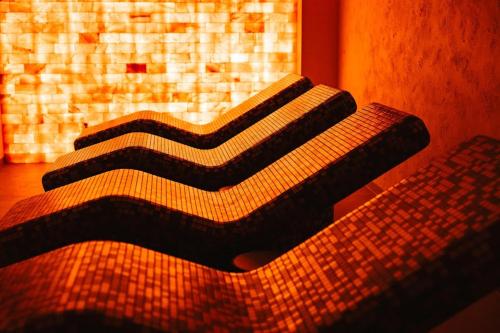 a close up of a bed in a room at Planet Imperial Apartman & SPA in Niš