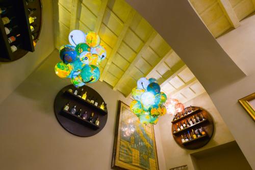 an overhead view of a room with balloons and bottles of wine at Hotel Santa Marta Suites in Milan