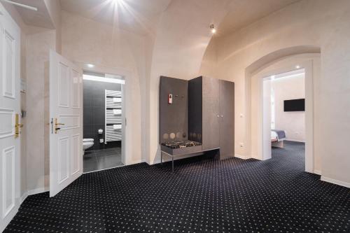 a room with a bathroom with a fireplace in it at EA Hotel Tereziánský dvůr in Hradec Králové