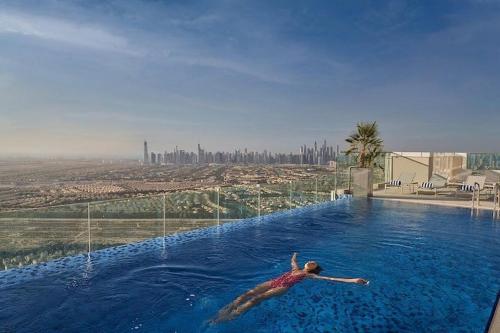 Vogue Vacation Homes, JVT Novotel Near Springs Souk Mall, One Bedroom Apartment with Large Balcony and Vibrant Community view, Access to all Amenities