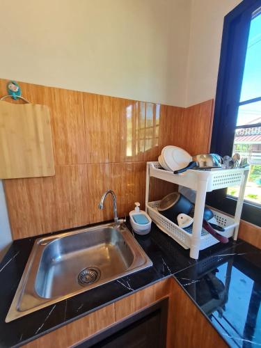 a kitchen with a sink and a counter top at Samati Hill - Pool Villa H2- Klong Ning Beach in Ko Lanta Yai