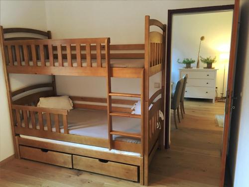 a room with two bunk beds and a mirror at Ferienwohnung Kogelblick Gosau in Gosau