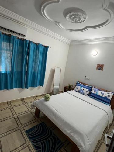 Llit o llits en una habitació de Merci Seigneur