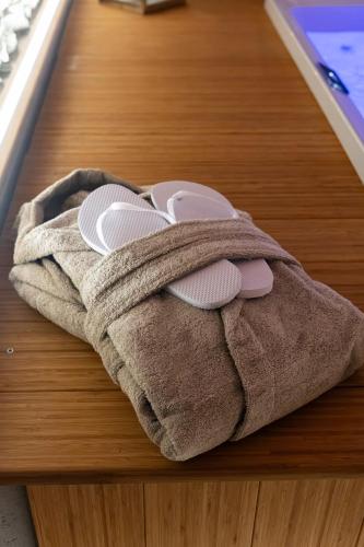 a brown towel sitting on top of a wooden floor at Bed and Breakfast Cascina Morelli 1862 in Avigliana