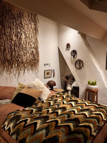 a bedroom with a large bed in a room at The Goose Garden in Hebden Bridge
