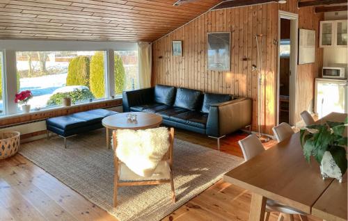 a living room with a couch and a table at Amazing Home In Egernsund With Wifi in Egernsund