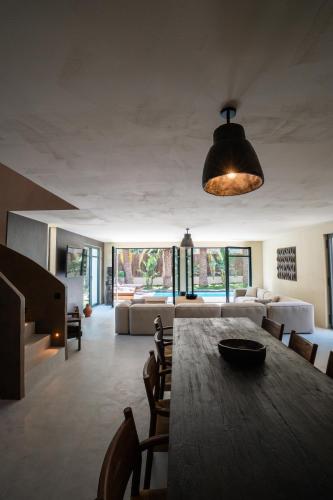 a large living room with a table and a couch at La Vague - Saint Tropez in Saint-Tropez