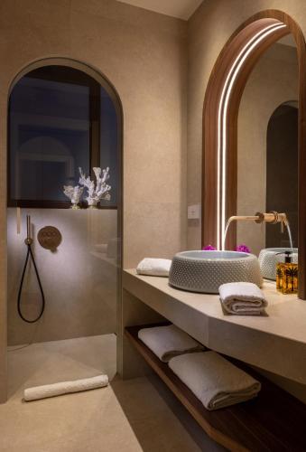 a bathroom with a sink and a mirror at Hotel Villa Taormina in Taormina