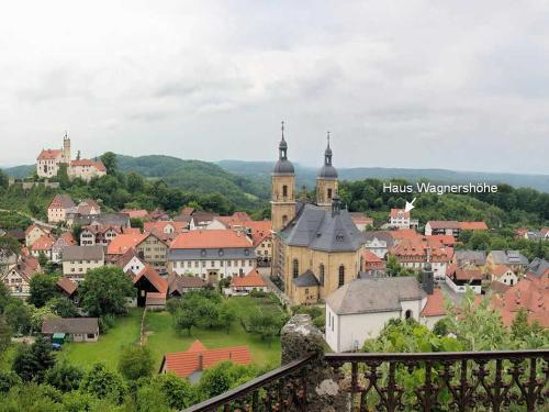a view of a town with a church and buildings at Ferienwohnung Haus Wagnershoehe in Gößweinstein