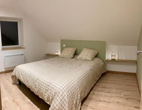 Llit o llits en una habitació de Le Champ d'Agatte