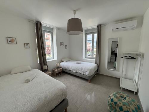 A bed or beds in a room at Les mimandes