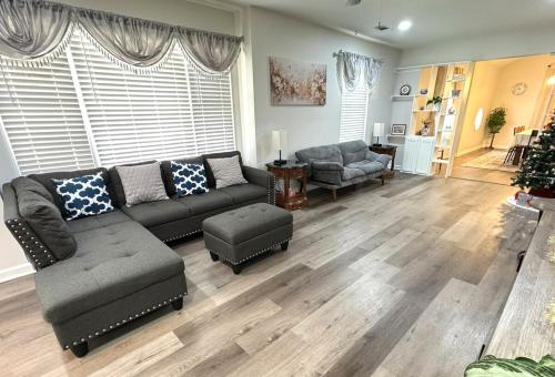 a living room with a couch and a chair at Brand new spacious and comfort 3-bedroom villa in east central in Memphis
