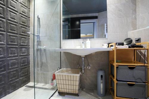 a bathroom with a sink and a shower at eliamaria artistic house in Lefkada