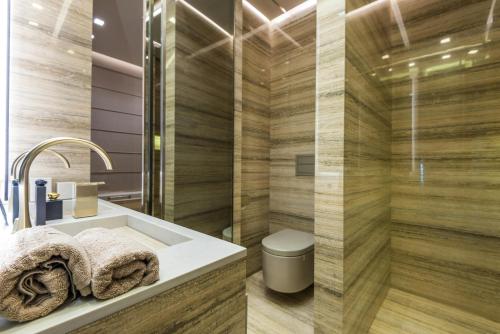 a bathroom with a sink and a toilet at Hotel Square Plaza At Airport in New Delhi