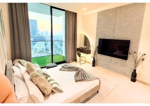 Chic Modern Studio Unit in JVC with 65 inch TV