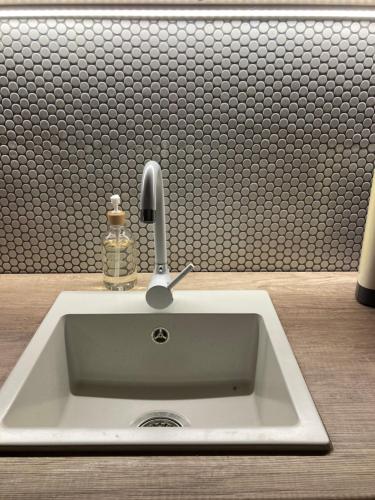 a sink with a faucet in a bathroom at Apartmán Ateliér in Bílé Vchynice